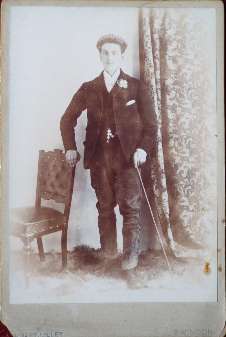 Photograph - Portrait of a young man standing with a cane