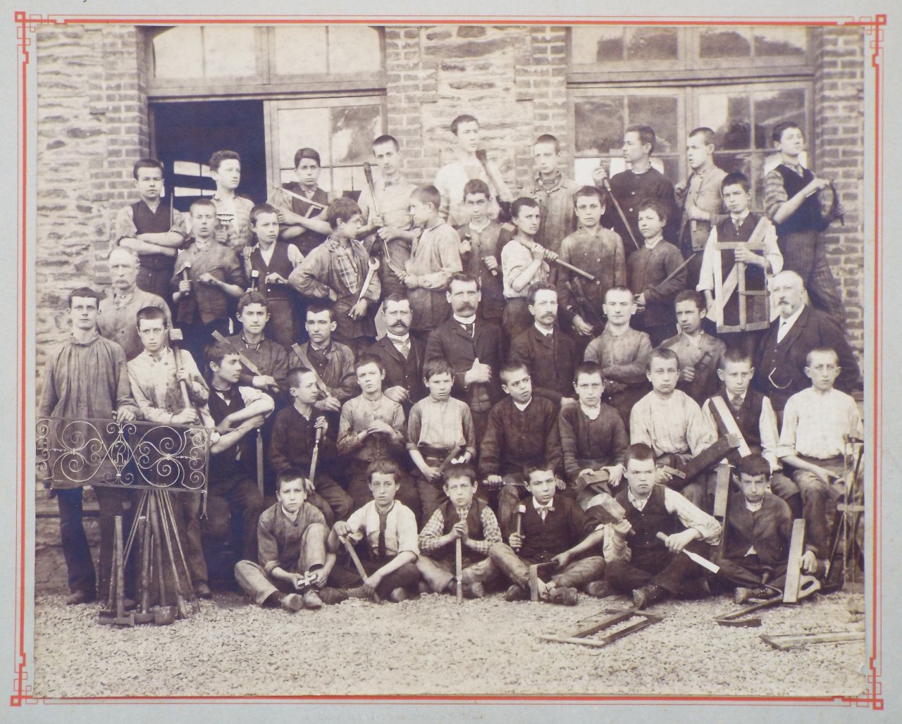 Photograph - L'ecole de l'Indus, Boulevard Laennec, Rennes, Group of staff and pupils posing with the tools of their trades c1905.