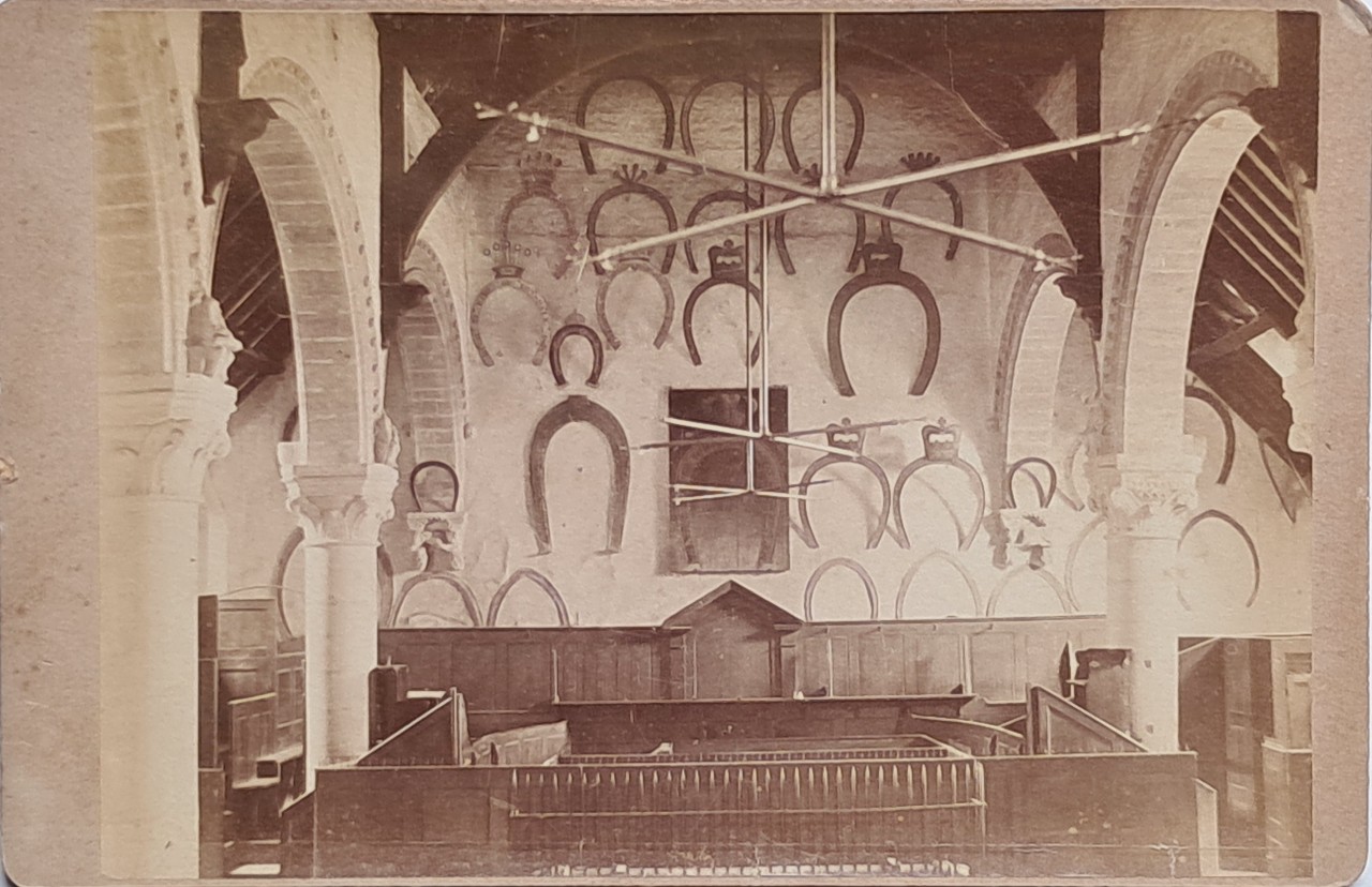 Photograph - Oakham Castle - Great Hall with horsh shoes collection